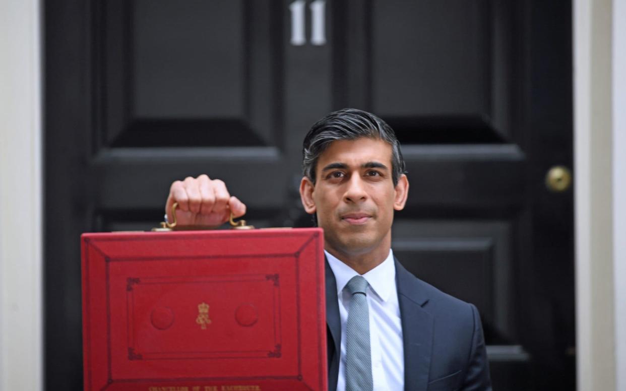 Chancellor of the Exchequer, Rishi Sunak, holds his ministerial 'Red Box' outside 11 Downing Street - PA