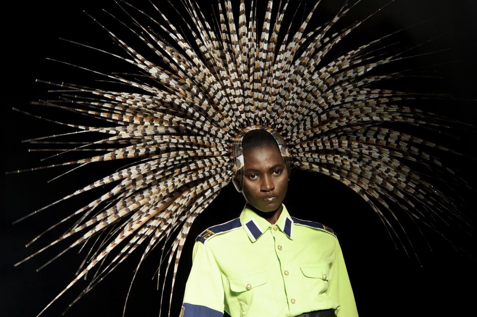 A model wears a design from the Philip Treacy Spring/Summer 2013 collection during London Fashion Week, Sunday, Sept. 16, 2012. (AP Photo/Jonathan Short)