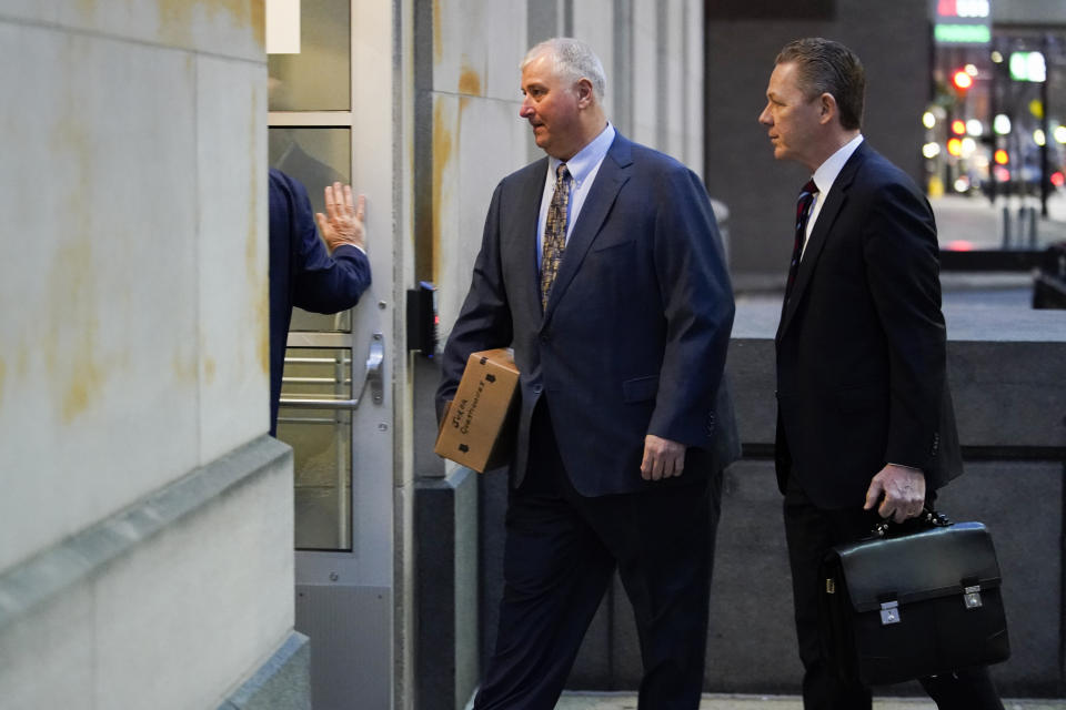 CORRECTS THAT PLANTS ARE FORMERLY OWNED BY FIRSTENERGY - Former Ohio House Speaker Larry Householder, center, walks into Potter Stewart U.S. Courthouse with his attorneys, Mark Marein, left, and Steven Bradley, right, before jury selection in his federal trial, Friday, Jan. 20, 2023, in Cincinnati. Householder and former Ohio Republican Party chair Matt Borges are charged with racketeering in an alleged $60 million scheme to pass state legislation to secure a $1 billion bailout for two nuclear power plantsformerlyowned by Akron, Ohio-based FirstEnergy. Householder and Borges have both pleaded not guilty. (AP Photo/Joshua A. Bickel)