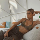 <p>Wearing a khaki chain bikini.<br><i>[Photo: Instagram/haileybaldwin]</i> </p>