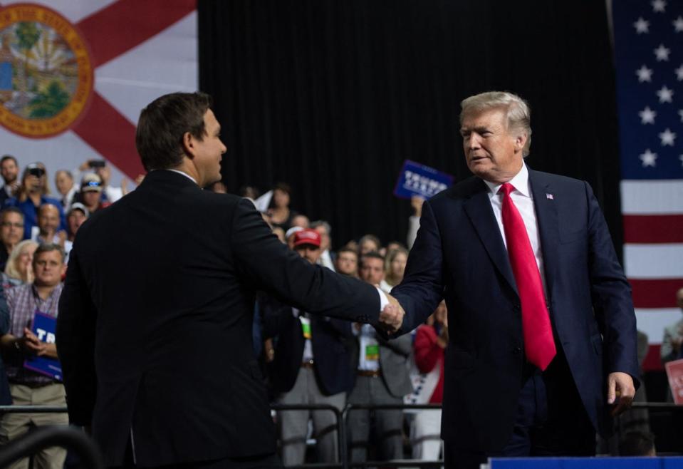 DeSantis and Trump in 2018 in happier times. The Florida governor may play on his relative youthfulness in contrast to the former president (AFP via Getty Images)