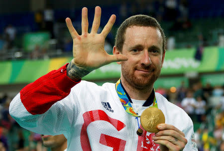 Bradley Wiggins (GBR) of Britain poses with his gold medal. REUTERSEric Gaillard/File Photo