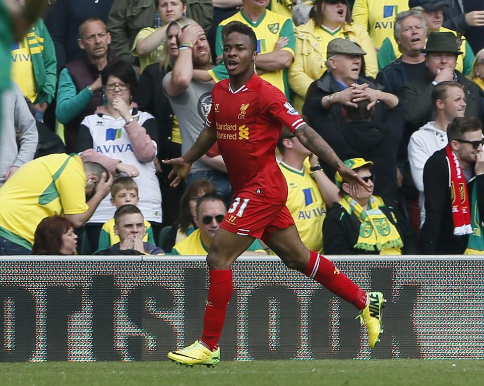 Liverpool's Raheem Sterling celebrates his second goal against Norwich City during their English Premier League soccer match at Carrow Road in Norwich, April 20, 2014. REUTERS/Stefan Wermuth (BRITAIN - Tags: SPORT SOCCER) NO USE WITH UNAUTHORIZED AUDIO, VIDEO, DATA, FIXTURE LISTS, CLUB/LEAGUE LOGOS OR "LIVE" SERVICES. ONLINE IN-MATCH USE LIMITED TO 45 IMAGES, NO VIDEO EMULATION. NO USE IN BETTING, GAMES OR SINGLE CLUB/LEAGUE/PLAYER PUBLICATIONS. FOR EDITORIAL USE ONLY. NOT FOR SALE FOR MARKETING OR ADVERTISING CAMPAIGNS
