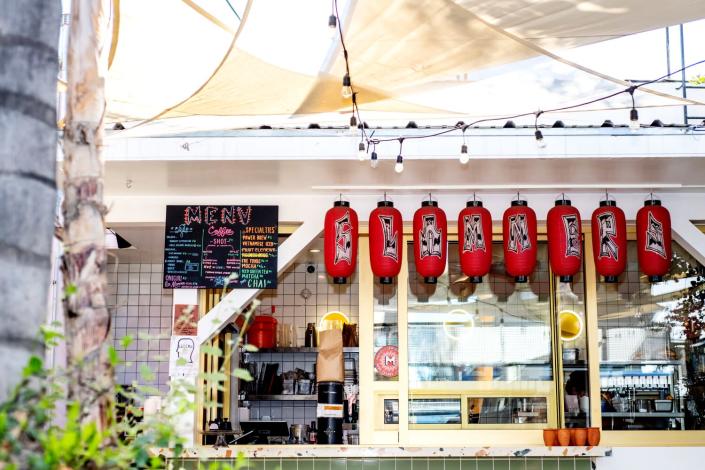 Slammers Cafe features a chalkboard menu and red Japanese paper lanterns.