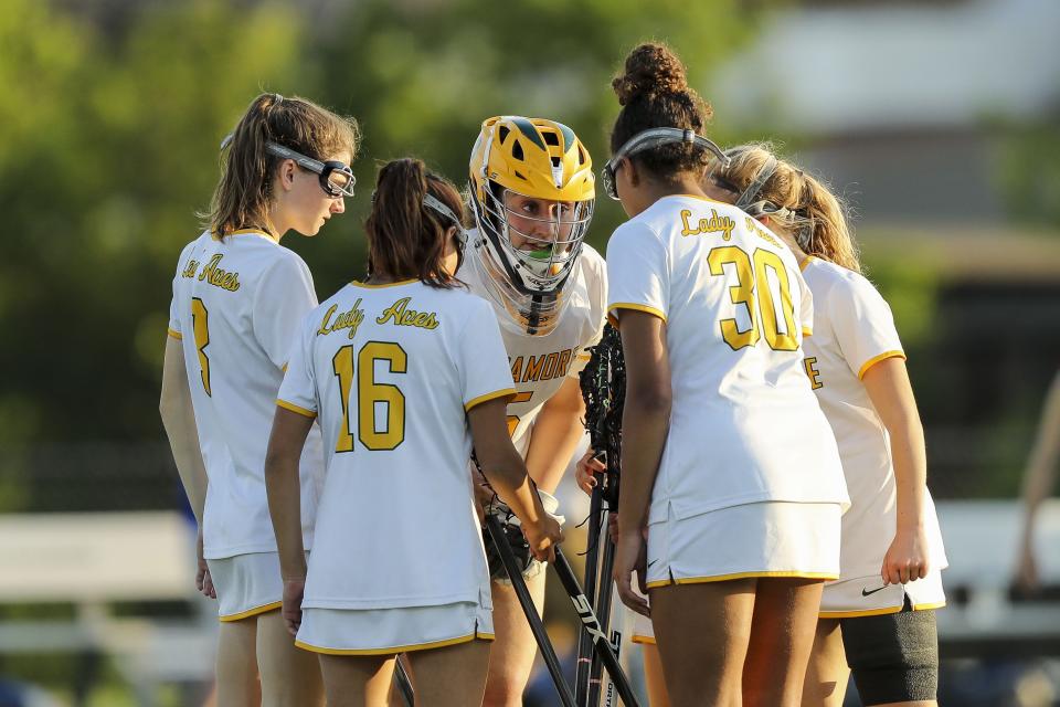 Sycamore goalie Aoife Black (5) huddles her team prior to the second half against Mariemont at Sycamore High School May 12, 2022.