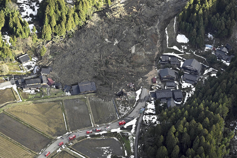 This aerial photo shows houses are collapsed by landslides caused by earthquakes in Wajima, Ishikawa prefecture, Japan Thursday, Jan. 4, 2024. More soldiers have been ordered to bolster the rescue operations Thursday, providing those in need with drinking water, hot meals and setting up bathing facilities after a magnitude 7.6 quake hit Ishikawa Prefecture and nearby regions Monday. (Kyodo News via AP)