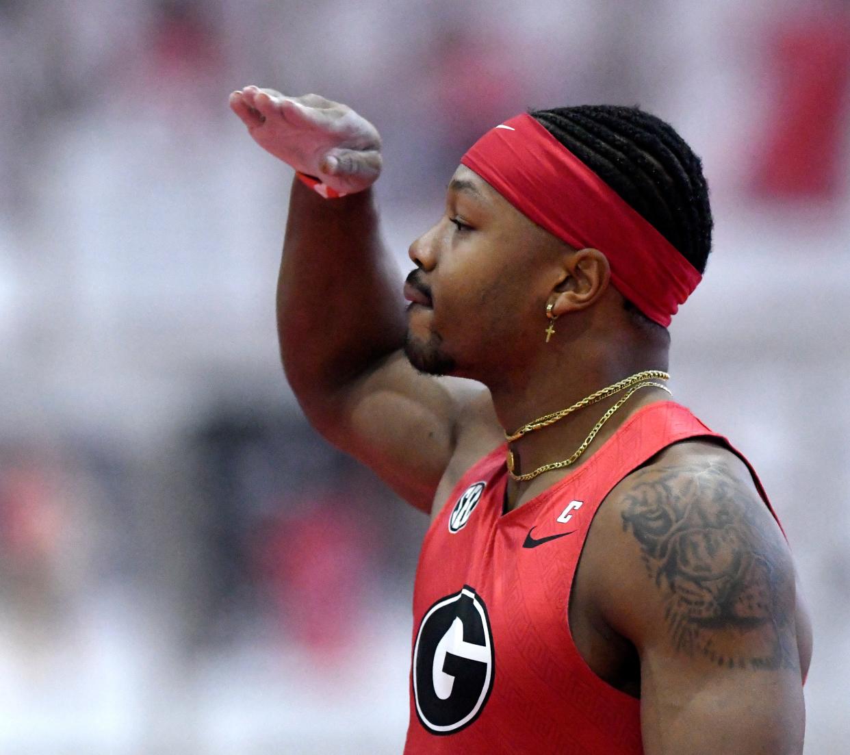 Georgia's Kyle Garland salutes after clearing a bar in the pole vault Friday at the Sports Performance Center. Garland, the collegiate record holder in the decathlon, posted a top-three score all-time among U.S. men in the indoor heptathlon at the Texas Tech Open & Multis meet.