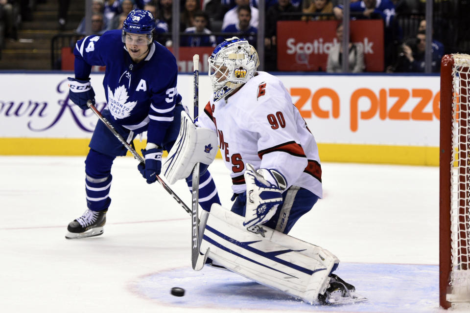 Toronto Maple Leafs center John Tavares (not shown) scores his team's second goal of an NHL hockey game against Carolina Hurricanes emergency goalie David Ayres (90) during second-period NHL hockey game action in Toronto, Saturday, Feb. 22, 2020. (Frank Gunn/The Canadian Press via AP)