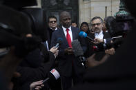 Gambia's Justice Minister Aboubacarr Tambadou comments outside the International Court in The Hague, Netherlands, Thursday, Jan. 23, 2020, after the court ordered Myanmar take all measures in its power to prevent genocide against the Rohingya. The United Nations' top court issued a decision on a request by Gambia. (AP Photo/Peter Dejong)