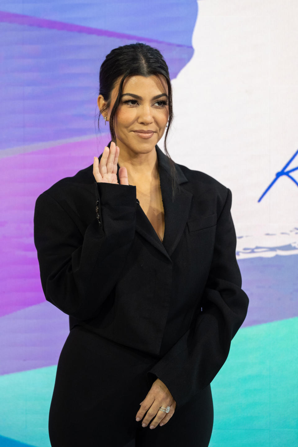 closeup of her waving at fans