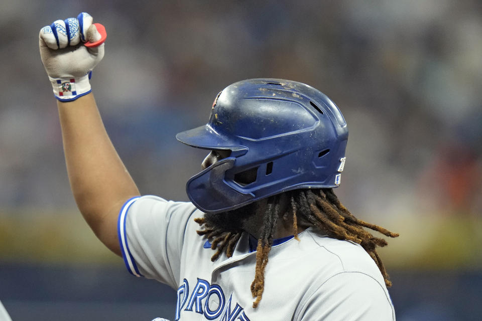 Toronto Blue Jays' Vladimir Guerrero Jr. celebrates his RBI single off Tampa Bay Rays relief pitcher Shawn Armstrong during the xxx inning of a baseball game Saturday, Sept. 23, 2023, in St. Petersburg, Fla. Blue Jays' George Springer scored on the hit. (AP Photo/Chris O'Meara)