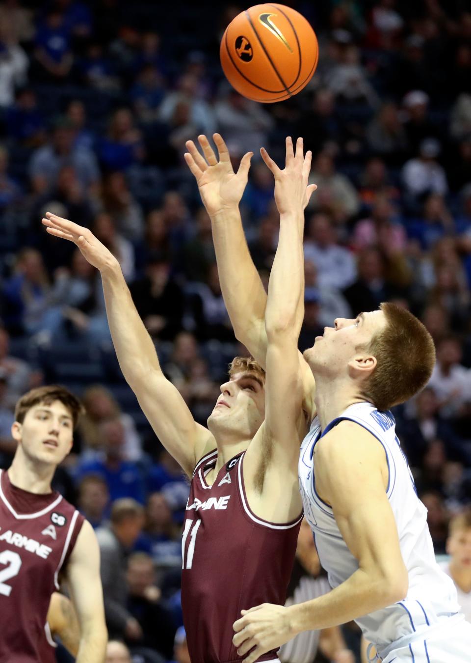 Bellarmine Knights guard Billy Smith (11) and Brigham Young Cougars forward Noah Waterman (0) reach for the ball during a men’s basketball game at the Marriott Center in Provo on Friday, Dec. 22, 2023. BYU won 101-59. | Kristin Murphy, Deseret News