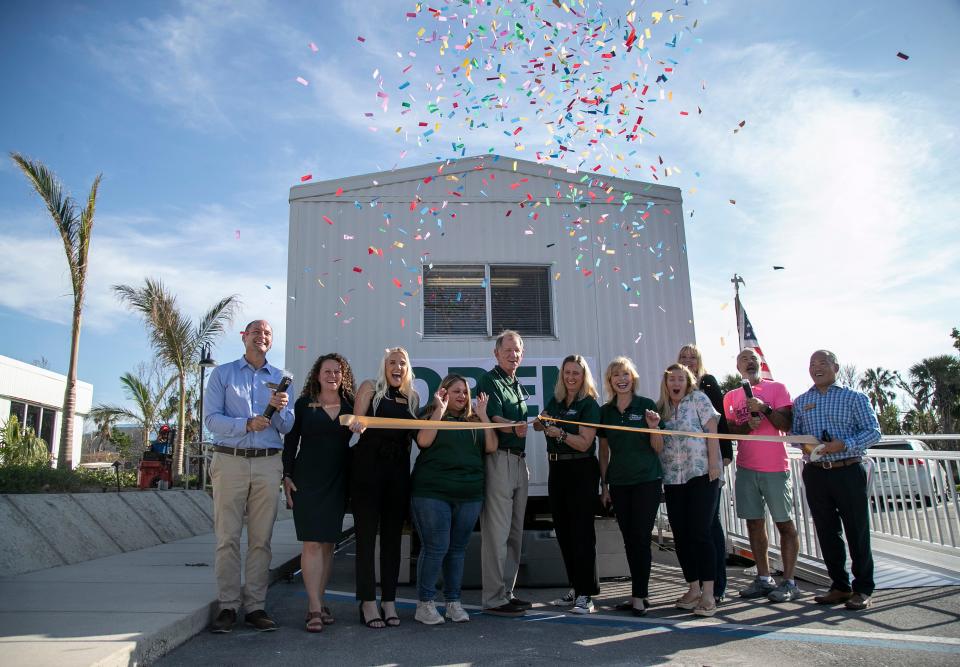 Representatives from the Bank of the Islands and the Sanibel Captiva Chamber celebrate the reopening of the bank on Sanibel on Wednesday, Nov. 30, 2022.