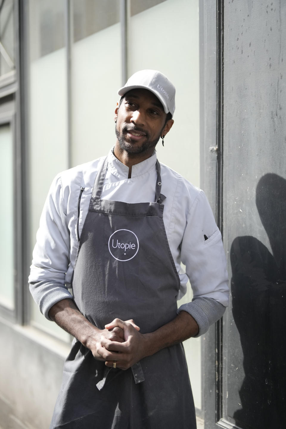 Baker Xavier Netry poses outside the Utopie bakery Friday, April 26, 2024 in Paris. Baker Xavier Netry was chosen this week as the 31st winner of Paris' annual "Grand Prix de la baguette" prize. The Utopie bakery in Paris' 11th district that Netry works for wins 4,000 euros ($4,290) and becomes one of the suppliers of the presidential Elysee Palace for a year. (AP Photo/Thibault Camus)