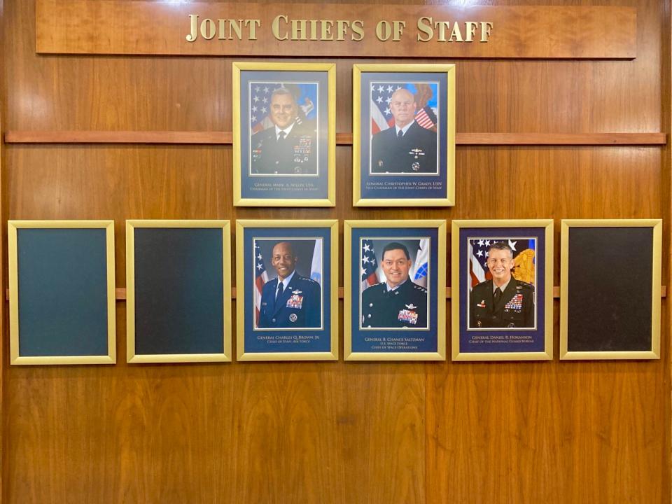 Three blank fames hang on the wall in the Pentagon representing the lack of three Senate-confirmed four-star members of the Joint Chiefs of Staff: the chief of staff of the Army, Commandant of the Marine Corps and Chief of Naval Operations.