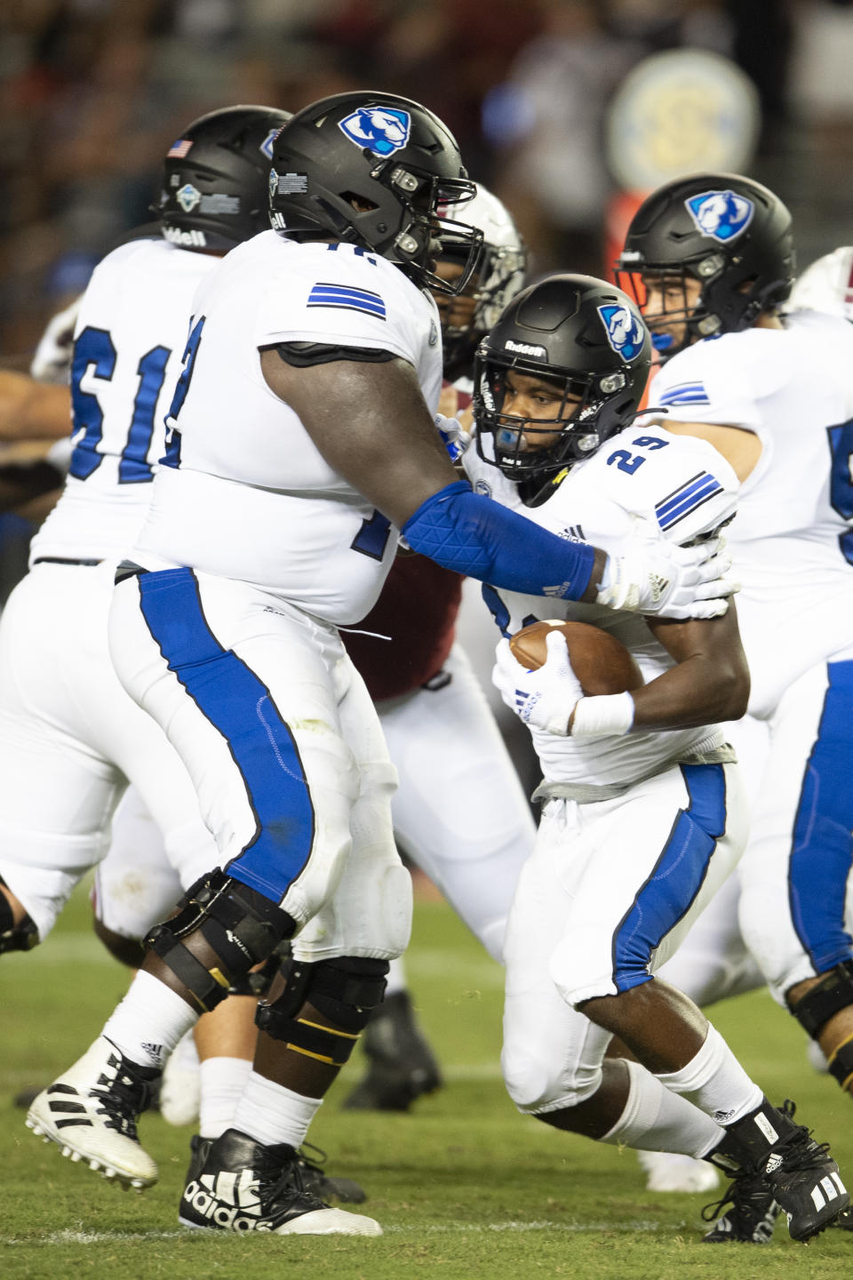 Eastern Illinois running back Kendi Young (29) runs into Eastern Illinois offensive lineman Elkhanan Tanelus (72) during the second half of an NCAA college football game against South Carolina, Saturday, Sept. 4, 2021, in Columbia, S.C. (AP Photo/Hakim Wright Sr.)