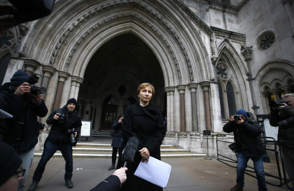 FILE - In this Thursday, Jan. 21, 2016 file photo, Marina Litvinenko, widow of former Russian spy Alexander Litvinenko, reads a statement outside the Royal Courts of Justice in London. The European Court of Human Rights on Tuesday, Sept. 21, 2021 backed the conclusion of a British inquiry that Russia was responsible for the killing of Alexander Litvinenko, who died in 2006 after drinking tea laced with a radioactive material. A former agent for the KGB and the post-Soviet successor agency FSB, Col. Alexander Litvinenko defected from Russia in 2000 and fled to London. He fell violently ill on Nov. 1, 2006, after drinking tea with two Russian men at a London hotel, and spent three weeks in hospital before he died. His tea was found to have been laced with radioactive polonium-210. (AP Photo/Kirsty Wigglesworth, File)