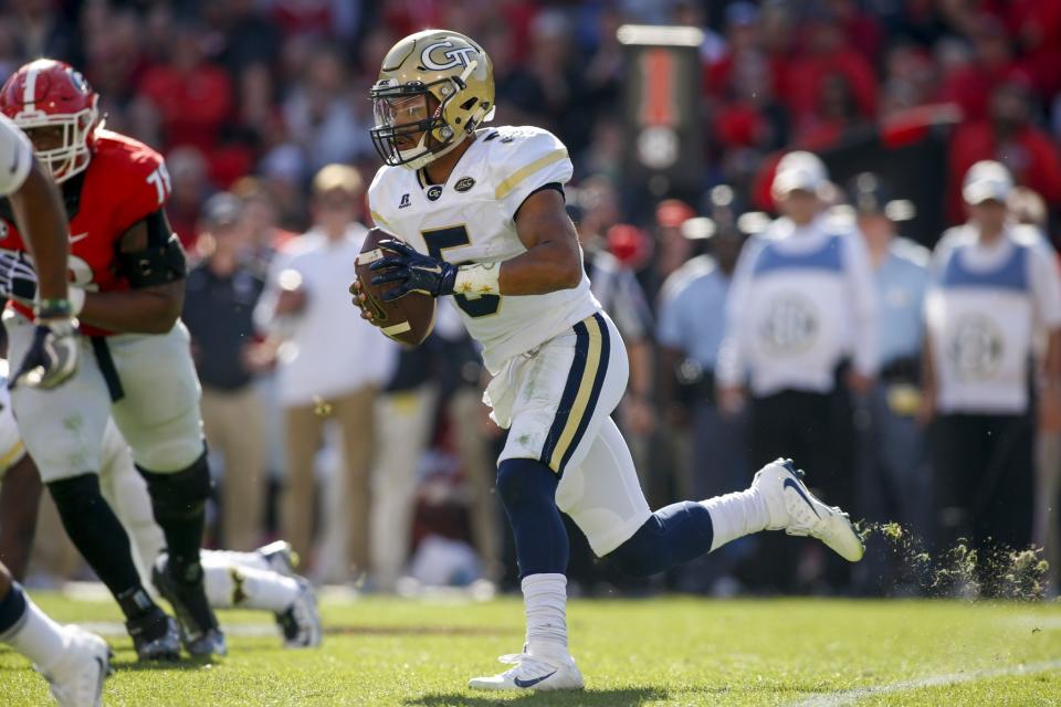 Georgia Tech QB Justin Thomas combined for 13 touchdowns this season. Georgia Tech quarterback Justin Thomas (5) runs the ball against Georgia in the first half of an NCAA college football game Saturday, Nov. 26, 2016, in Athens, Ga. (AP Photo/Brett Davis)