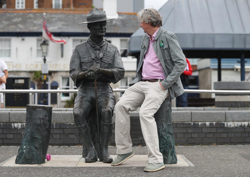 Mark Howell, Deputy leader of BCP Council, sits next to a statue of Robert Baden-Powell on Poole Quay in Dorset ahead of its expected removal to "safe storage" following concerns about his actions while in the military and "Nazi sympathies". The action follows a raft of Black Lives Matter protests across the UK, sparked by the death of George Floyd, who was killed on May 25 while in police custody in the US city of Minneapolis.