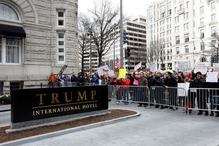 FILE PHOTO - Activists gather outside the Trump International Hotel to protest President Donald Trump's executive actions on immigration in Washington, DC, U.S. on January 29, 2017. REUTERS/Aaron P. Bernstein/File Photo