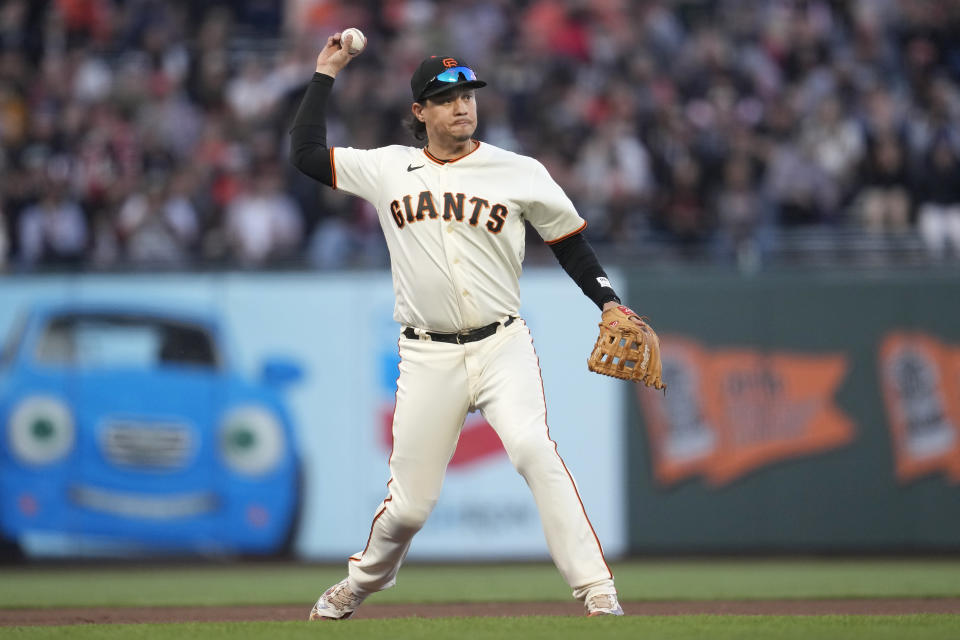 San Francisco Giants third baseman Wilmer Flores throws out Colorado Rockies' Alan Trejo at first base during the seventh inning of a baseball game in San Francisco, Sunday, Sept. 10, 2023. (AP Photo/Jeff Chiu)