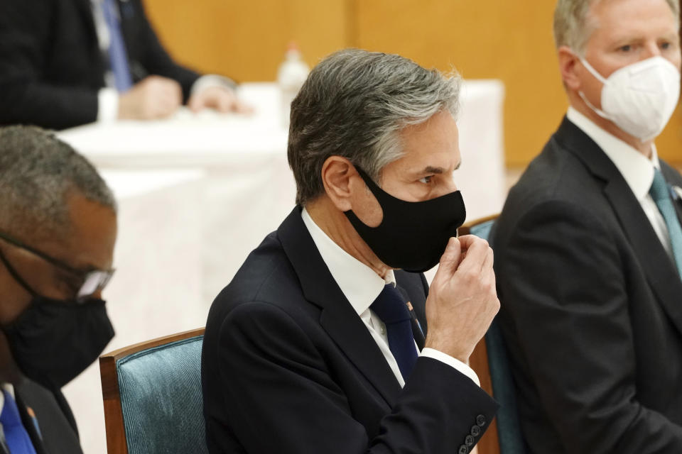 U.S. Secretary of State Antony Blinken, center, and Defense Secretary Lloyd Austin, left, meet with Japanese Prime Minister Yoshihide Suga, not in picture, during a courtesy call at the prime minister's official residence in Tokyo Tuesday, March 16, 2021. (AP Photo/Eugene Hoshiko, Pool)