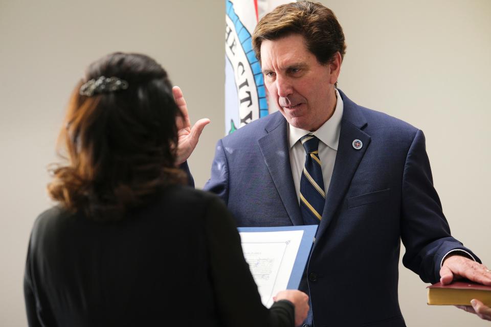 Ward 8 Councilman Mark Stonecipher takes the official oath of office in 2023 with his wife, Debbie, and mother, Roseanne, present.