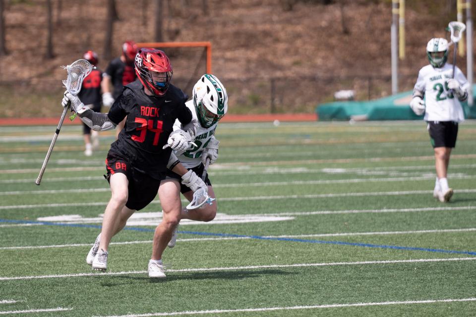 Apr 27, 2024; Hillsdale, NJ, USA; Glen Rock lacrosse at Pascack Valley. GR #34 Will Corry and PV #22 Colin Foley.