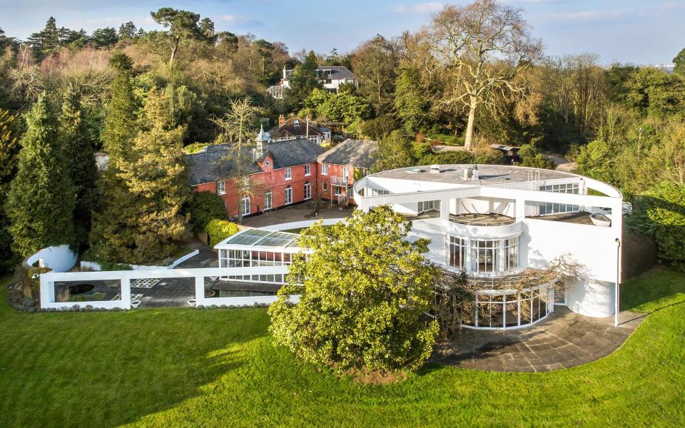 St Ann's Court has two buildings: the red Coach House and the modern white Round House - FRENCH+TYE