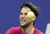 Dominic Thiem, of Austria, returns a shot to Daniil Medvedev, of Russia, during a men's semifinal match of the US Open tennis championships, Friday, Sept. 11, 2020, in New York. (AP Photo/Frank Franklin II)