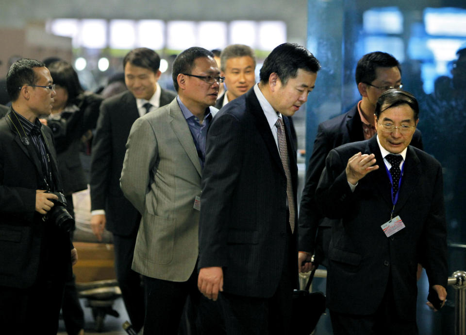 Chinese Ambassador to Egypt Song Aiguo, right, accompanies Hong Kong immigration officers upon their arrival at the Cairo International airport in Egypt, Wednesday, Feb. 27, 2013. Nineteen people were killed on Tuesday, Feb. 26, 2013 in what appeared to be the deadliest hot air ballooning accident on record. The balloon was carrying 20 tourists from France, Britain, Belgium, Japan, Hong Kong, and an Egyptian pilot. (AP Photo/Amr Nabil)