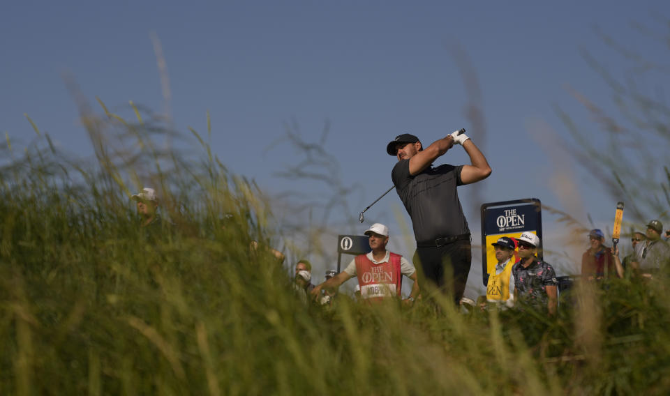 United States' Brooks Koepka play his shot from the 3rd tee during the first round British Open Golf Championship at Royal St George's golf course Sandwich, England, Thursday, July 15, 2021. (AP Photo/Alastair Grant)