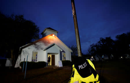 A police hat hangs outside the First Baptist Church of Sutherland Springs where 26 people were killed in a shooting attack last week, as the church was opened to the public as a memorial to those killed, in Sutherland Springs, Texas, U.S. November 12, 2017. REUTERS/Rick Wilking