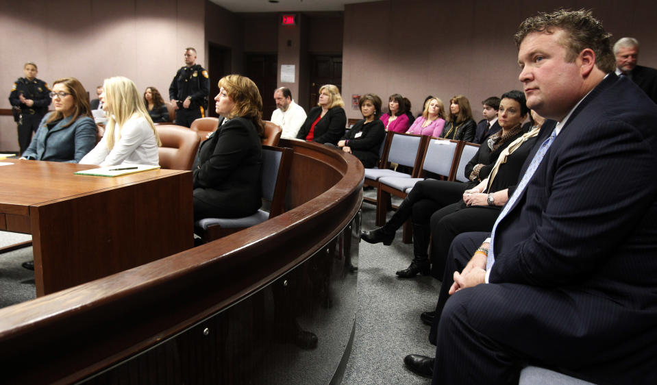 Mark Bovenizer, right, the husband of frormer "Melrose Place" actress Amy Locane-Bovenizer, 40, of Hopewell Township, looks toward the Superior Court Judge Robert Reed, as the jury returns a verdict on Tuesday, Nov. 27, 2012 in Somerville, N.J. The jurors convicted Amy Locane-Bovenizer of vehicular homicide, but acquitted her of a more serious charge, aggravated manslaughter, in the 2010 accident that killed a 60-year-old woman. Somerset County prosecutors said Locane-Bovenizer's blood-alcohol level was nearly three times the legal limit when the crash occurred on a dark two-lane road in Montgomery Township. The defence conceded she was driving under the influence. But her lawyer claimed a woman was chasing her after an earlier accident, forcing her to speed. (AP Photo/The Star-Ledger, Robert Sciarrino, Pool)