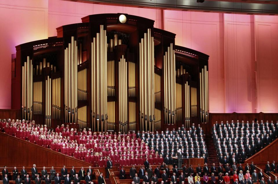 FILE - In this Oct. 1, 2016, file photo, the Mormon Tabernacle Choir of The Church of Jesus Christ of Latter-day Saints, sings in the Conference Center at the morning session of the two-day Mormon church conference in Salt Lake City. It’s typically an unquestioned honor to participate in the inauguration of an American president. This time, though, it’s different. The sharp divisions over Donald Trump’s election have politicians, celebrities and even high school students debating whether taking part in the inauguration is a political act that demonstrates support for the new president and his agenda or a nonpartisan tribute to democratic traditions and the peaceful transfer of power. (AP Photo/George Frey, File)