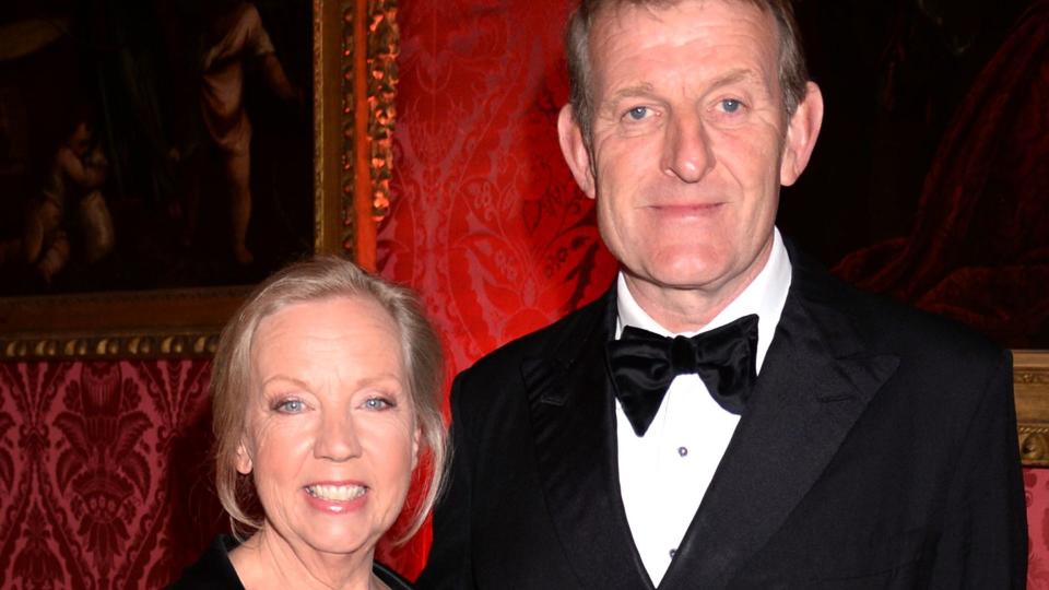 Deborah Meaden in a black dress with her Paul Meaden in a tux