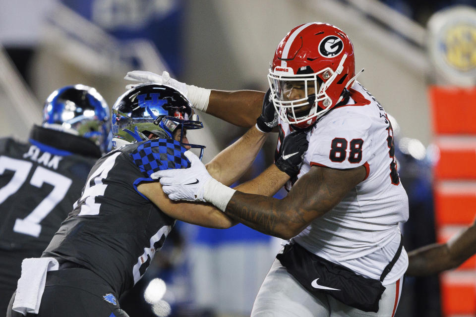 Kentucky tight end Josh Kattus (84) blocks Georgia defensive lineman Jalen Carter (88) during the second half of an NCAA college football game in Lexington, Ky., Saturday, Nov. 19, 2022. (AP Photo/Michael Clubb)