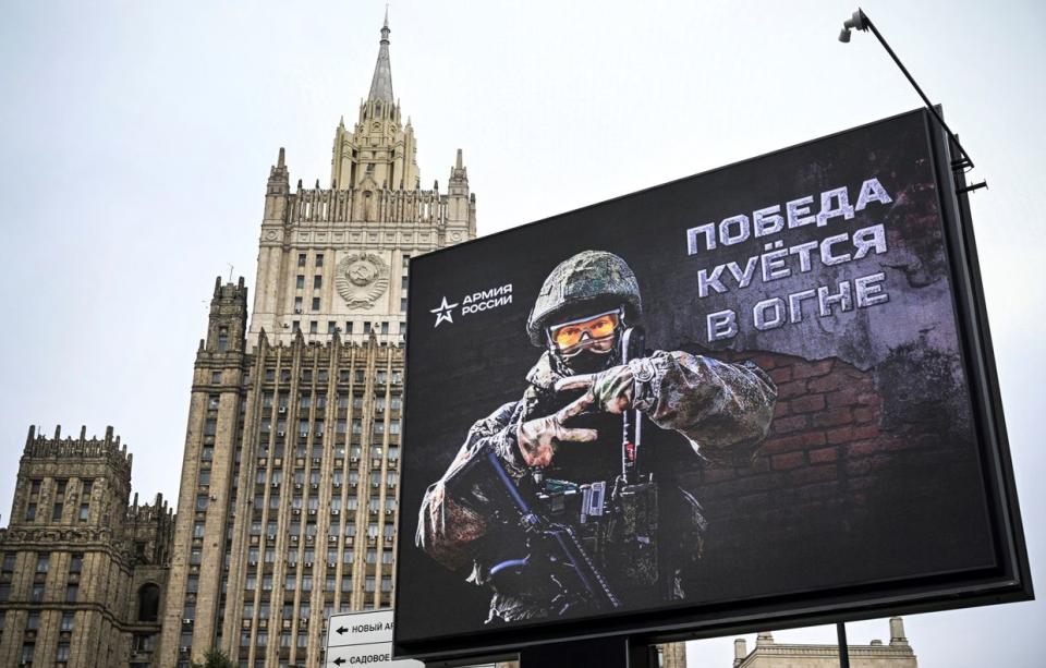 The Russian Foreign Ministry's building is seen behind a billboard with a soldier showing the letter "Z" – a tactical insignia of Russian troops in Ukraine – and reading "Victory is being forged in fire" in central Moscow on Oct. 13, 2022. (Alexander Nemenov/AFP via Getty Images)