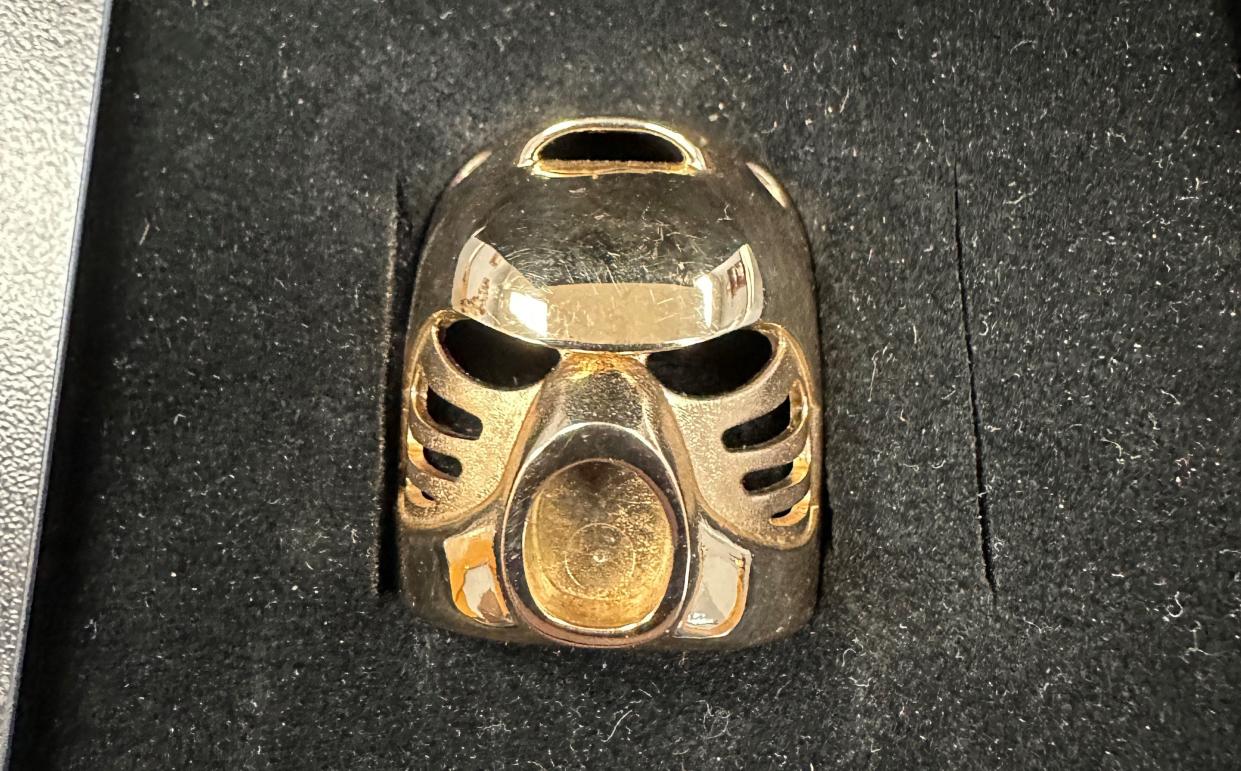 A rare 14-karat gold LEGO piece called the "Bionicle Golden Kanohi Hau mask," found at a Goodwill store in central Pennsylvania was auctioned last week for more than $18,000.