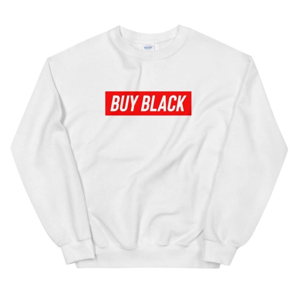 Get the <a href="https://shop.obws.com/collections/buy-black/products/buy-black-sweatshirt" target="_blank" rel="noopener noreferrer">"Buy Black" sweatshirt from Official Black Wall Street for $40</a>