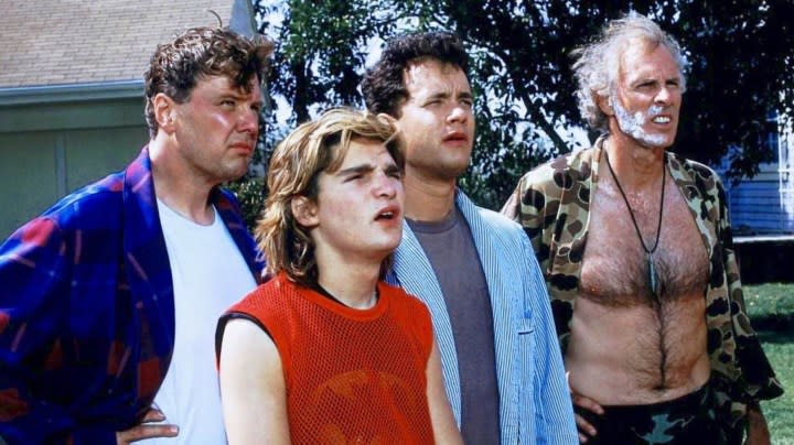 Four men stand outside in The 'Burbs.