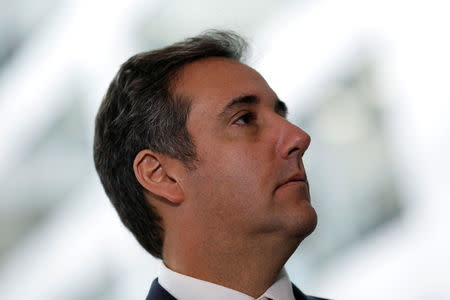 Michael Cohen, President Donald Trump's personal attorney, looks on as his attorney (not pictured) delivers a statement to reporters after meeting with Senate Intelligence Committee staff on Capitol Hill in Washington, U.S., September 19, 2017. REUTERS/Aaron P. Bernstein