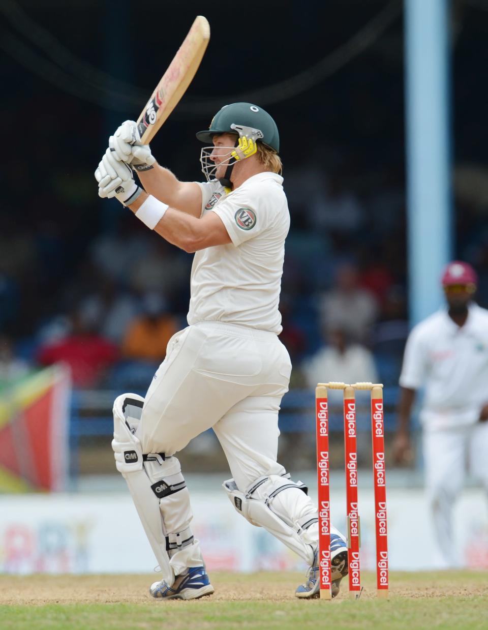 Batsman Shane Watson of Australia hits a six during the first day of the second-of-three Test matches between Australia and West Indies April 15, 2012 at Queen's Park Oval in Port of Spain, Trinidad. AFP PHOTO/Stan HONDA (Photo credit should read STAN HONDA/AFP/Getty Images)