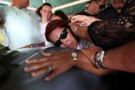 <p>Friends of Juan Carlos Nieves Rodriguez, one of the victims of the shooting at the Pulse night club in Orlando, Fla., outside the funeral parlor at his hometown of Caguas, Puerto Rico, June 20, 2016. (Reuters/Alvin Baez) </p>