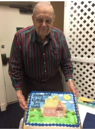 Bob Ward celebrates his 93rd birthday during a school retiree gathering.