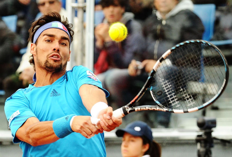 Italy's Fabio Fognini returns the ball to Britain's James Ward, during their Davis Cup World Group quarterfinal match in Naples, Italy, Friday April 4, 2014. (AP Photo/Salvatore Laporta)