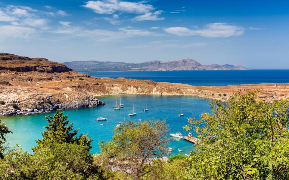 The harbour in Lindos, on Rhodes - GETTY IMAGES