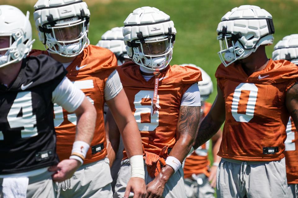 Texas players went through their first preseason practice of fall camp Wednesday at Denius Fields. The Longhorns' season opener is four weeks away: Sept. 2 at home against Rice.