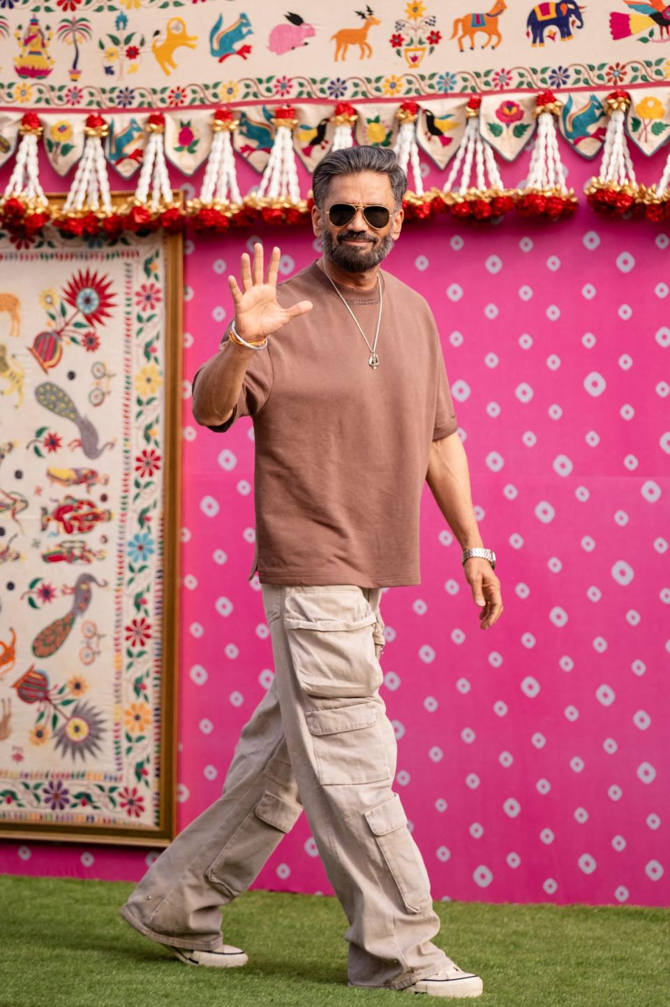 This handout photograph taken and released by Reliance on March 1, 2024, shows Bollywood actor Suniel Shetty upon his arrival at Jamnagar Airport in Jamnagar, to attend a three-day pre-wedding celebration hosted by billionaire tycoon Mukesh Ambani, for his son Anant Ambani and Radhika Merchant.