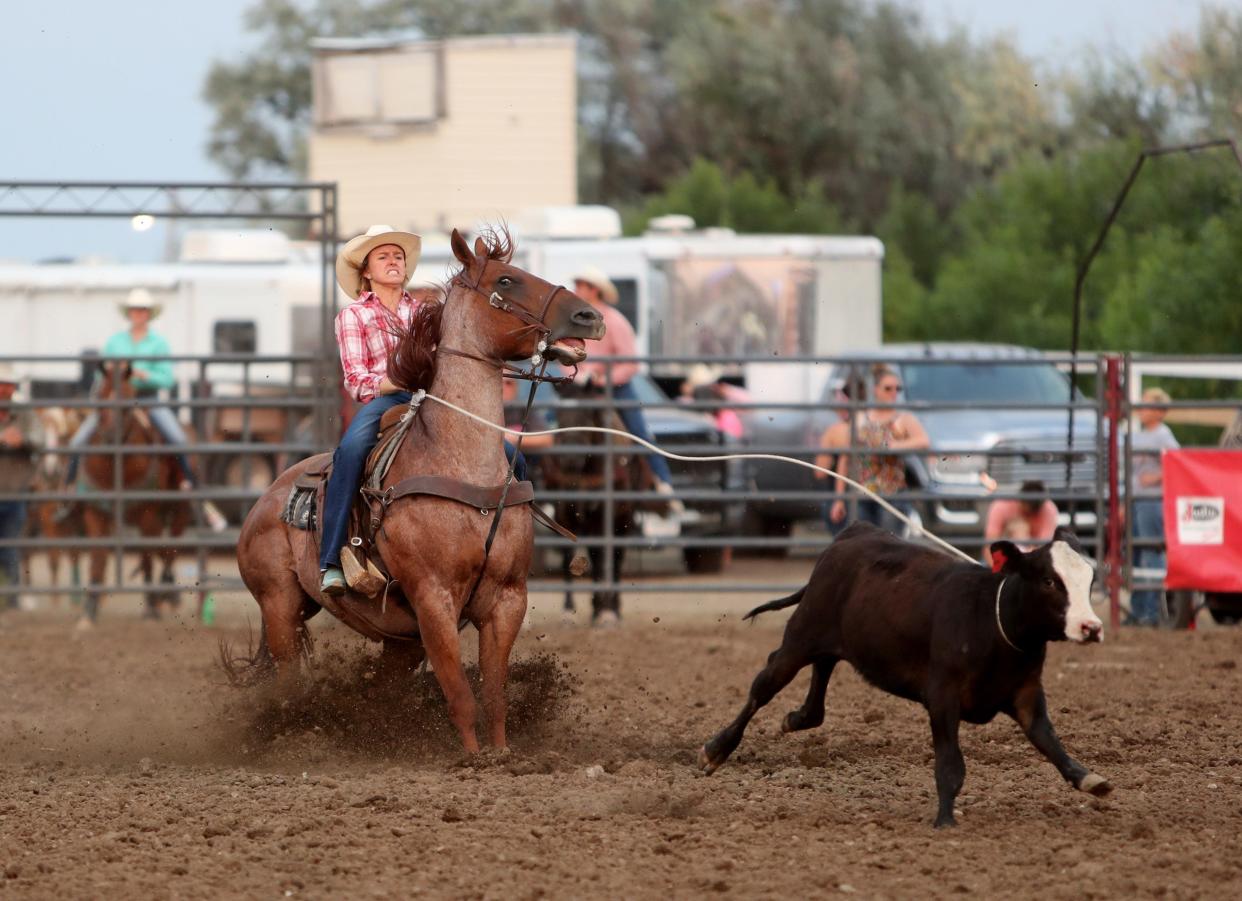 Brooke Howell of Belle Fourche ties down the calf in 3.3 seconds in the breakaway event at the 2021 Dacotah Stampede Rodeo at the Brown County Fair. American News file photo